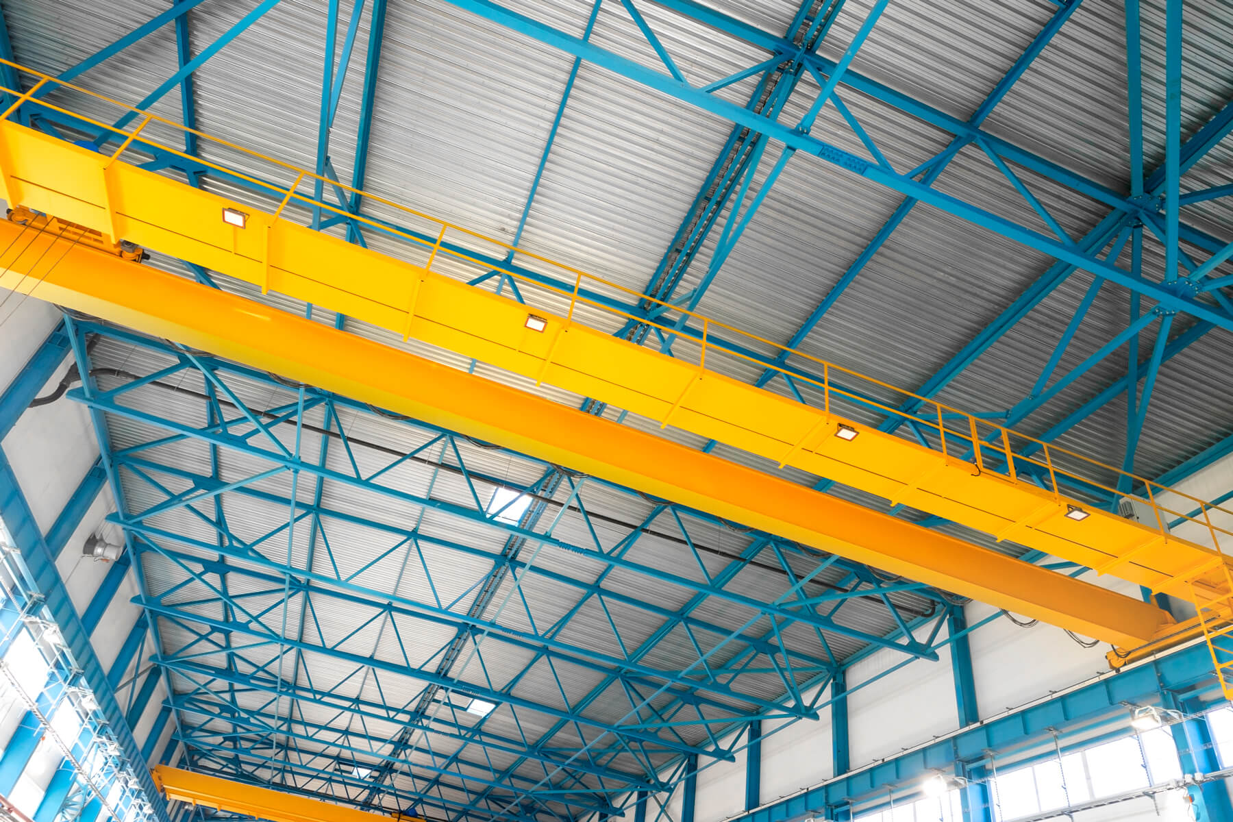 blue-steel-frame-of-metal-industrial-roof-in-wareh (1)